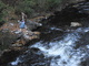 Travelers rest by river